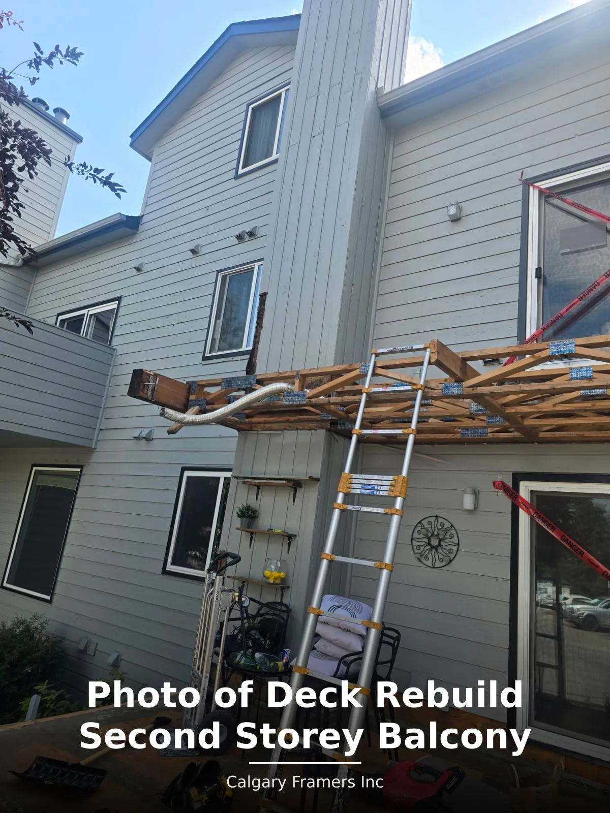 Second-storey balcony rebuild in progress on a two-storey home