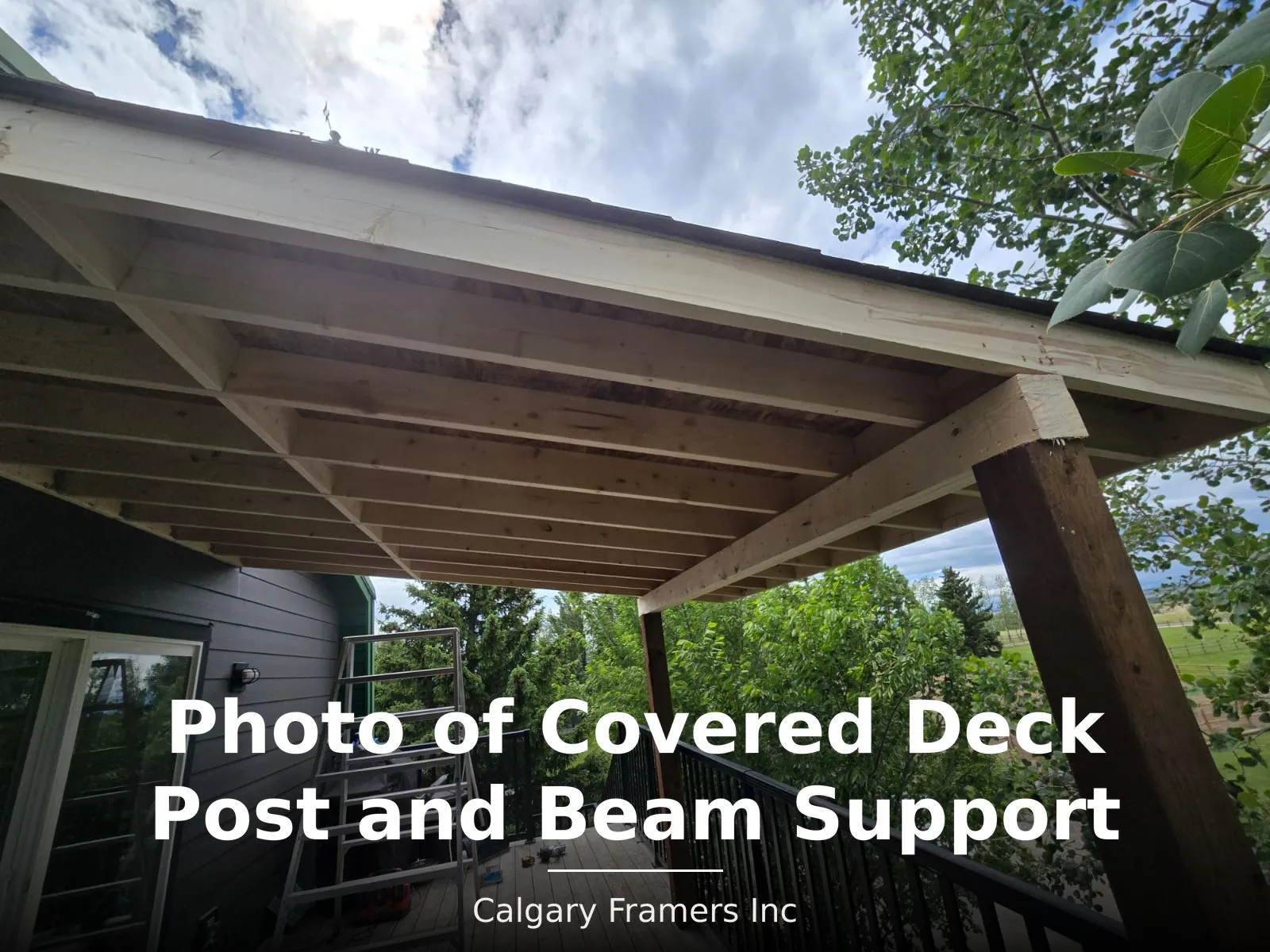 Covered deck beam and rafters carried on a timber post at the deck edge