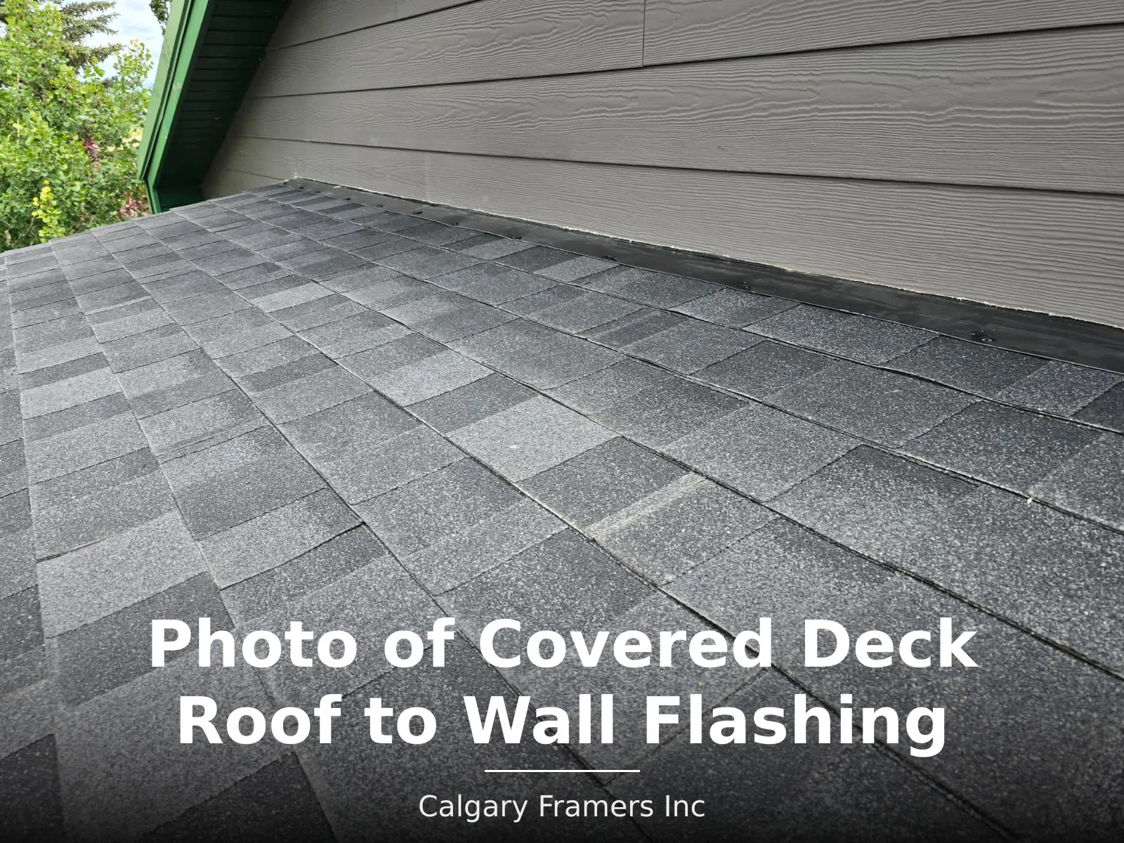 Roof-to-wall flashing where covered deck shingles meet the house siding