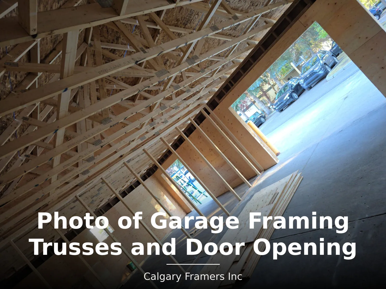 Garage roof trusses above a framed overhead door opening