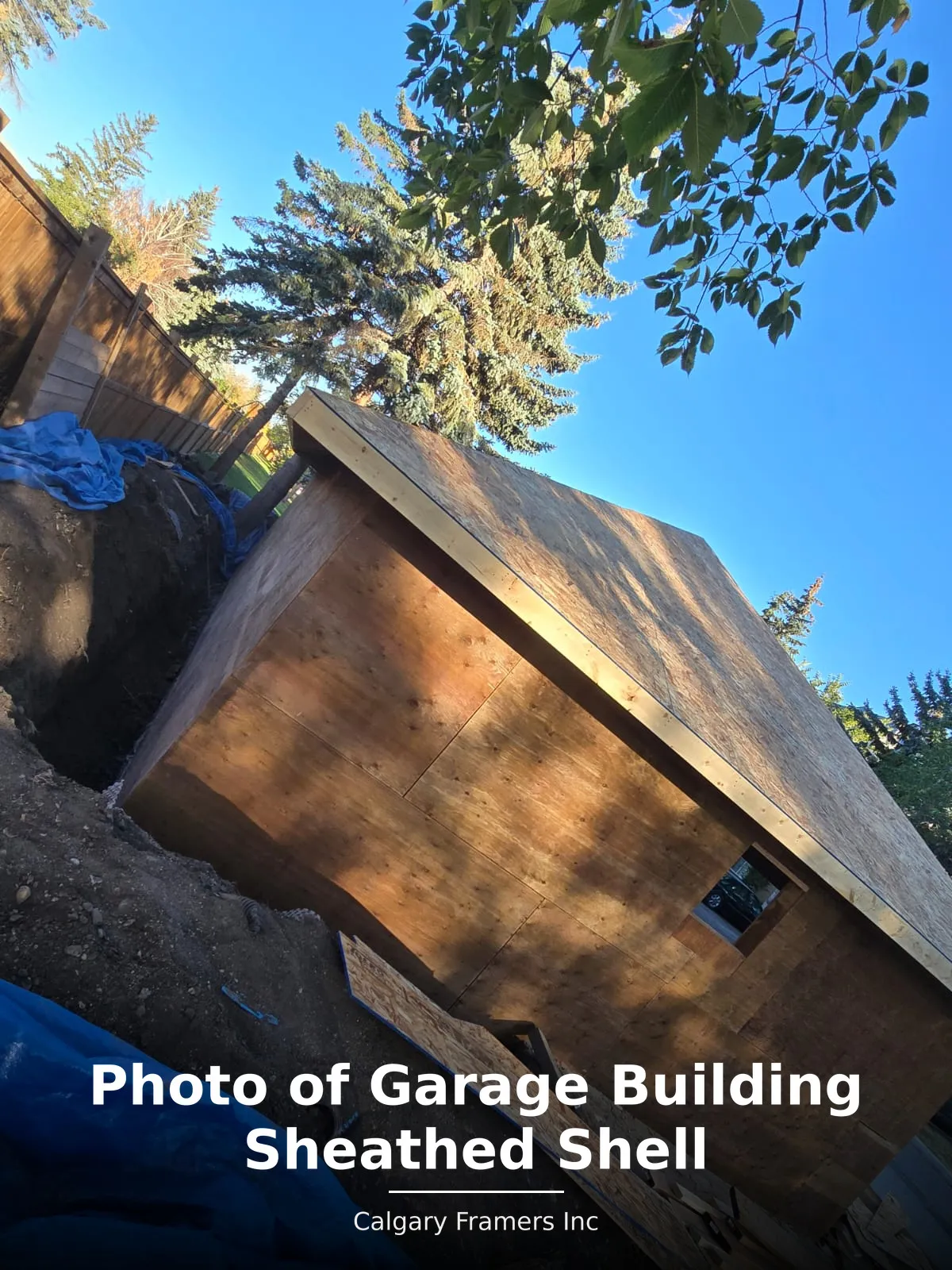 Sheathed garage shell on a newly excavated site