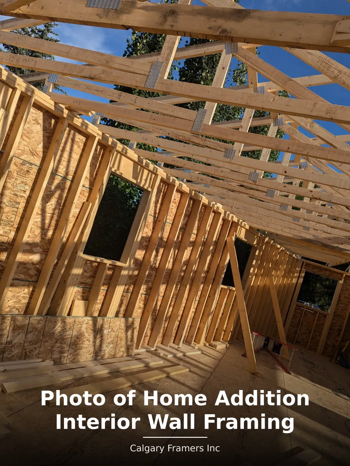 Interior wall framing and window openings inside a home addition