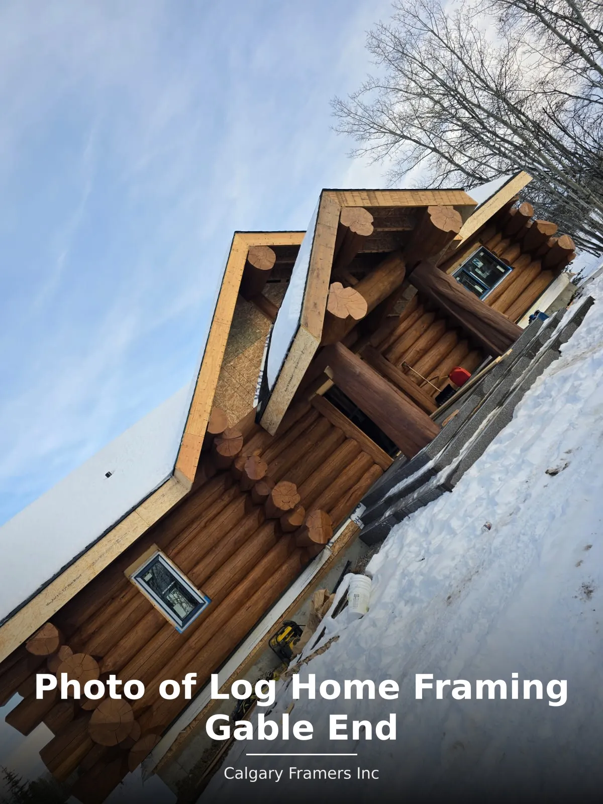 Framed gable end on a log home in winter