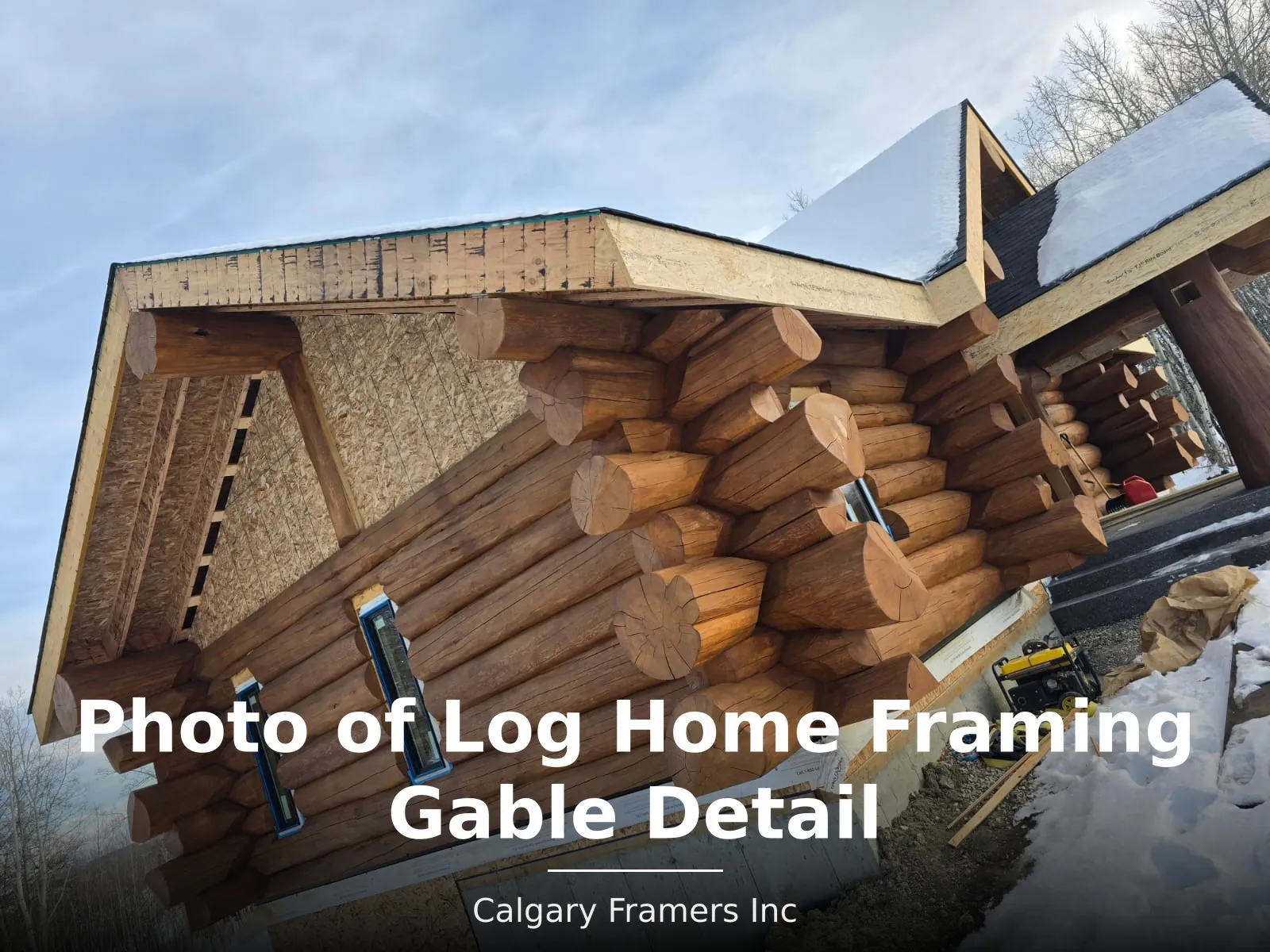 New gable framing meeting an existing log wall