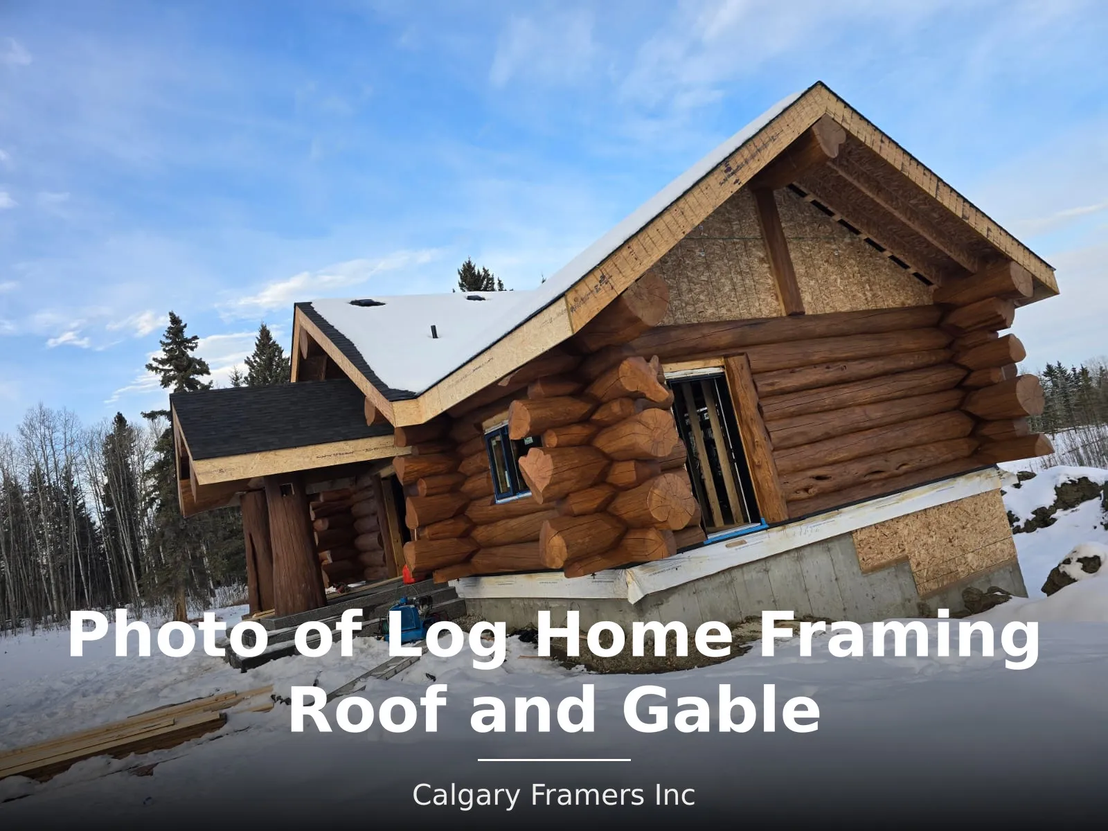 Log home with newly framed roof and gable structure